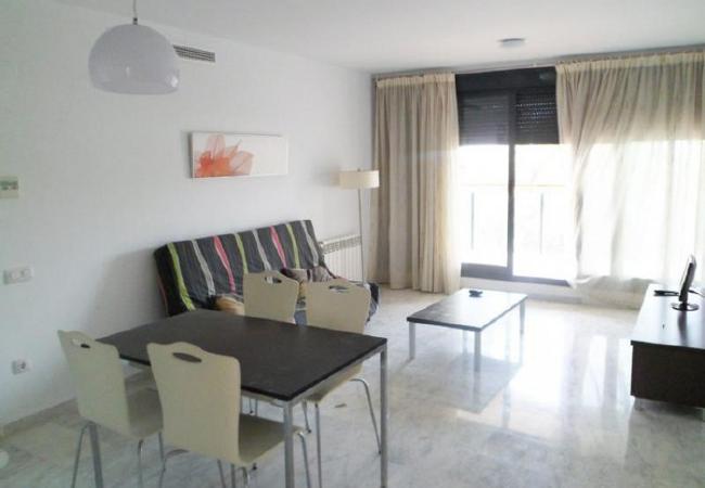 Spacious living-dining room The spacious living-dining room has a sofa, a TV and a dining table and chairs.