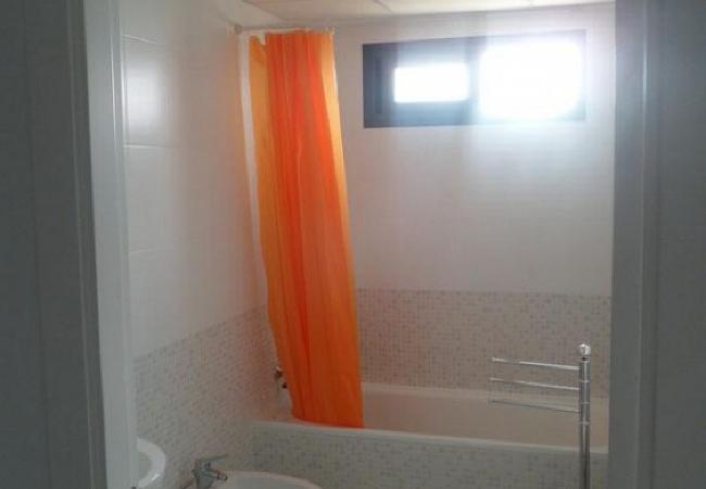 Bathroom with bathtub The bathroom has a bathtub, a toilet and a sink. The towels are included.