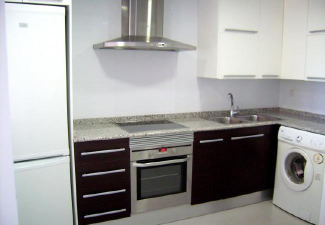 Fully equipped kitchen The kitchen is fully-equipped for cooking. There's a microwave, an oven, a hob, a fridge and kitchenware