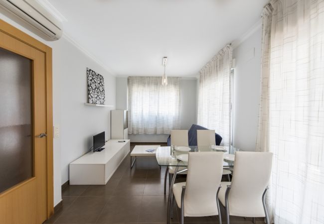 The spacious living-dining area The living-dining space has a dining table and chairs, a sofa, a televisión and more furnishings.